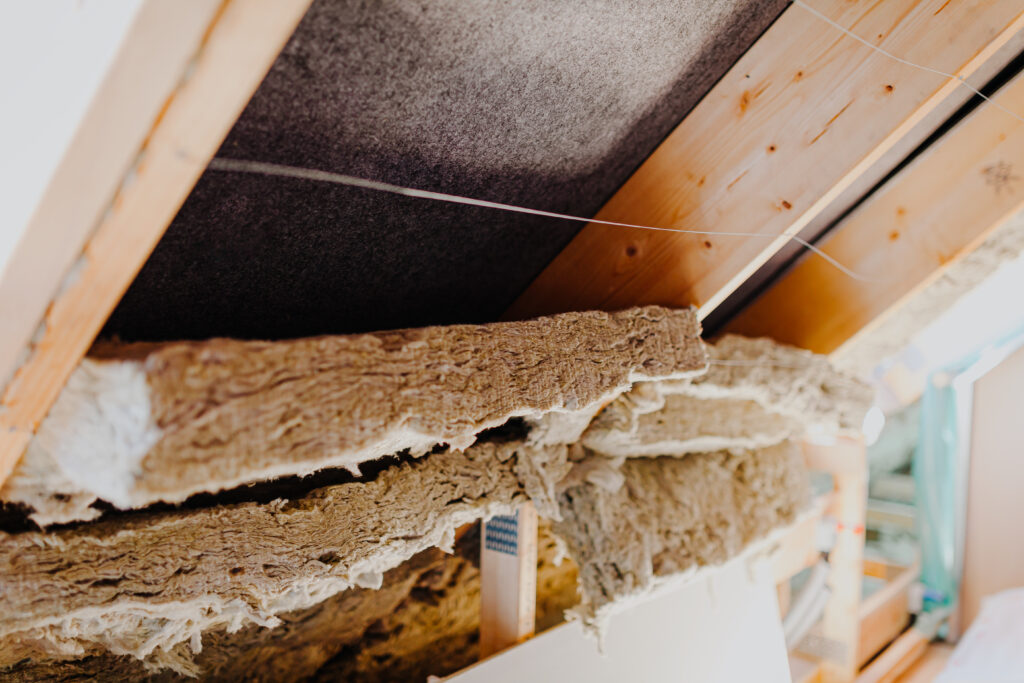 Old deteriorating attic insulation in a home before removal